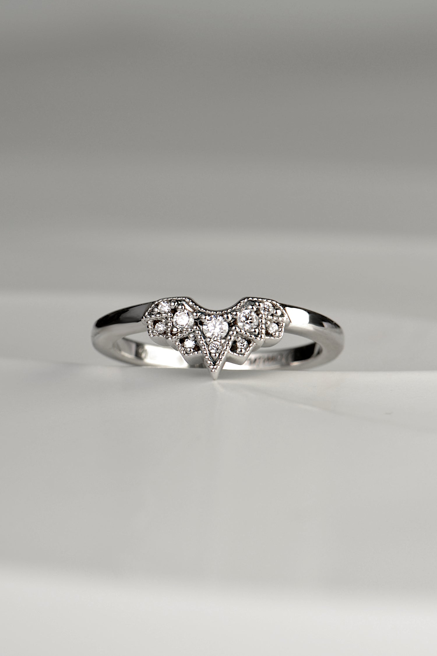 art deco starburst design diamond set shaped wedding ring with ten diamonds