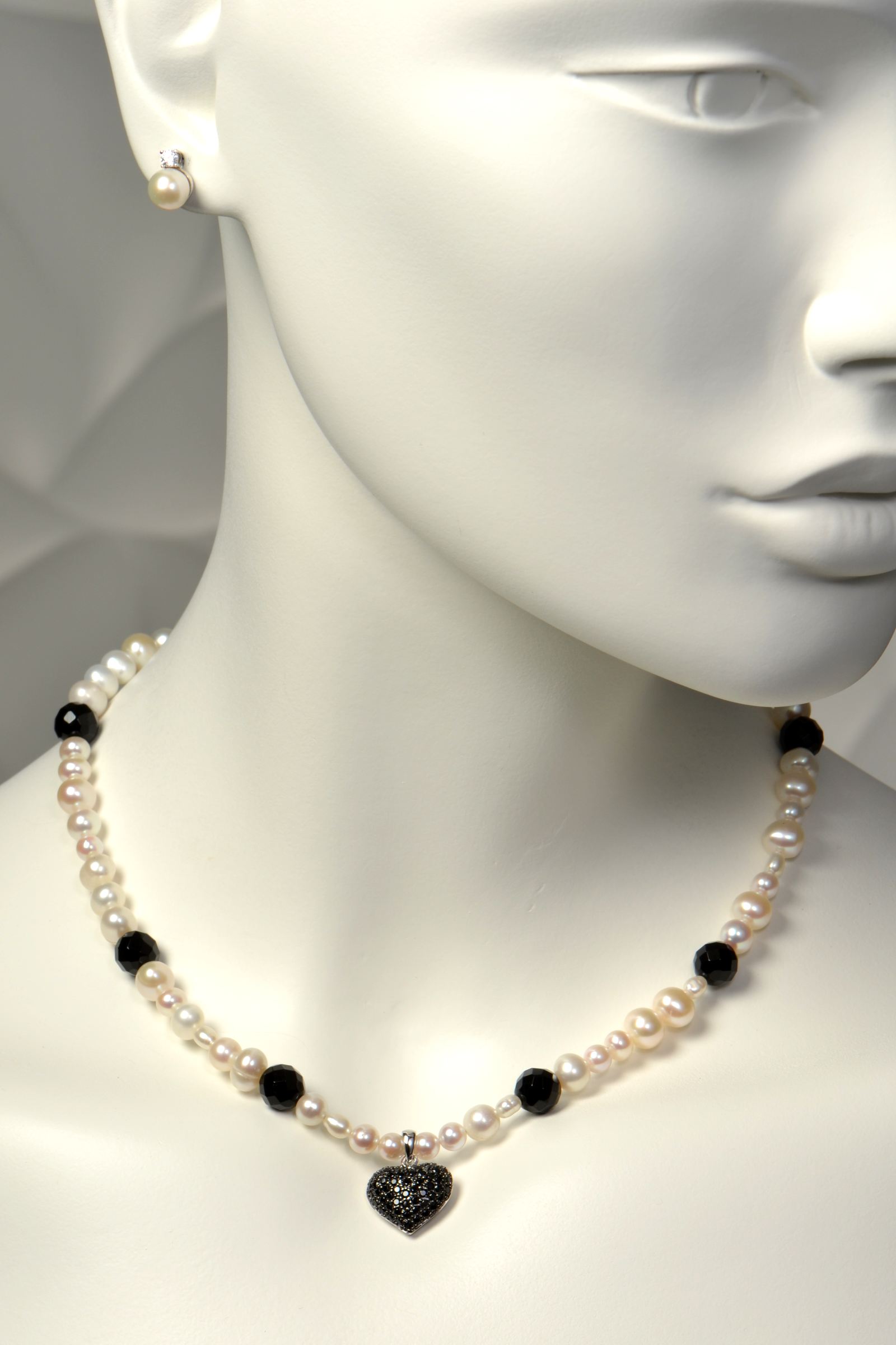 17-inch cultured pearl necklace with irregular natural pearls, six faceted onyx gemstones, and 15mm sterling silver heart pendant pavé-set with black cubic zirconias with matching pearl stud earrings