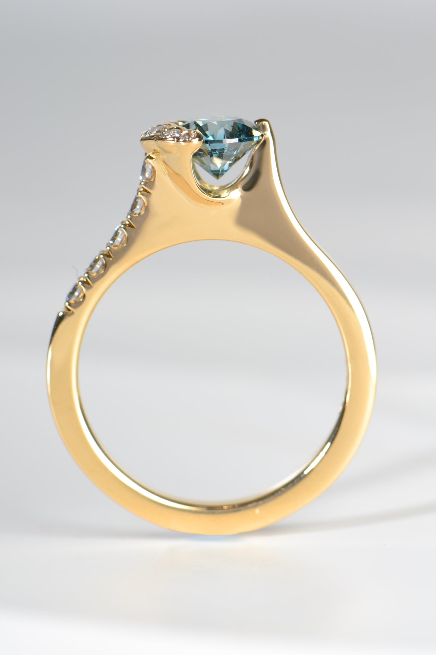 designer engagement ring that you can see the point of the diamond side on, like a tension set diamond ring