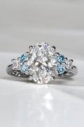 Blue Sky Spark platinum ring with 3.09ct oval lab diamond and vivid blue lab diamond accents