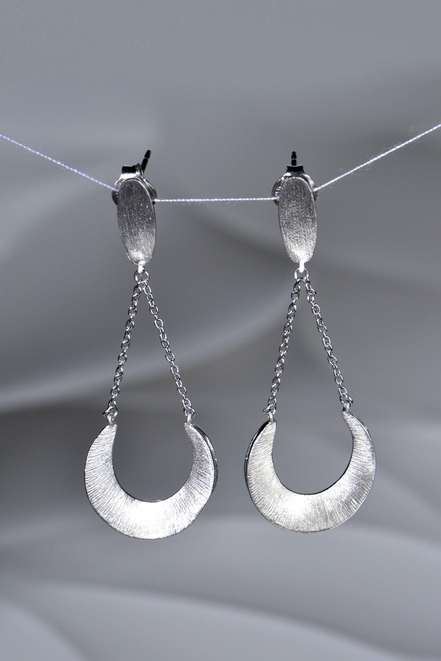 crescent silver drop designer earrings