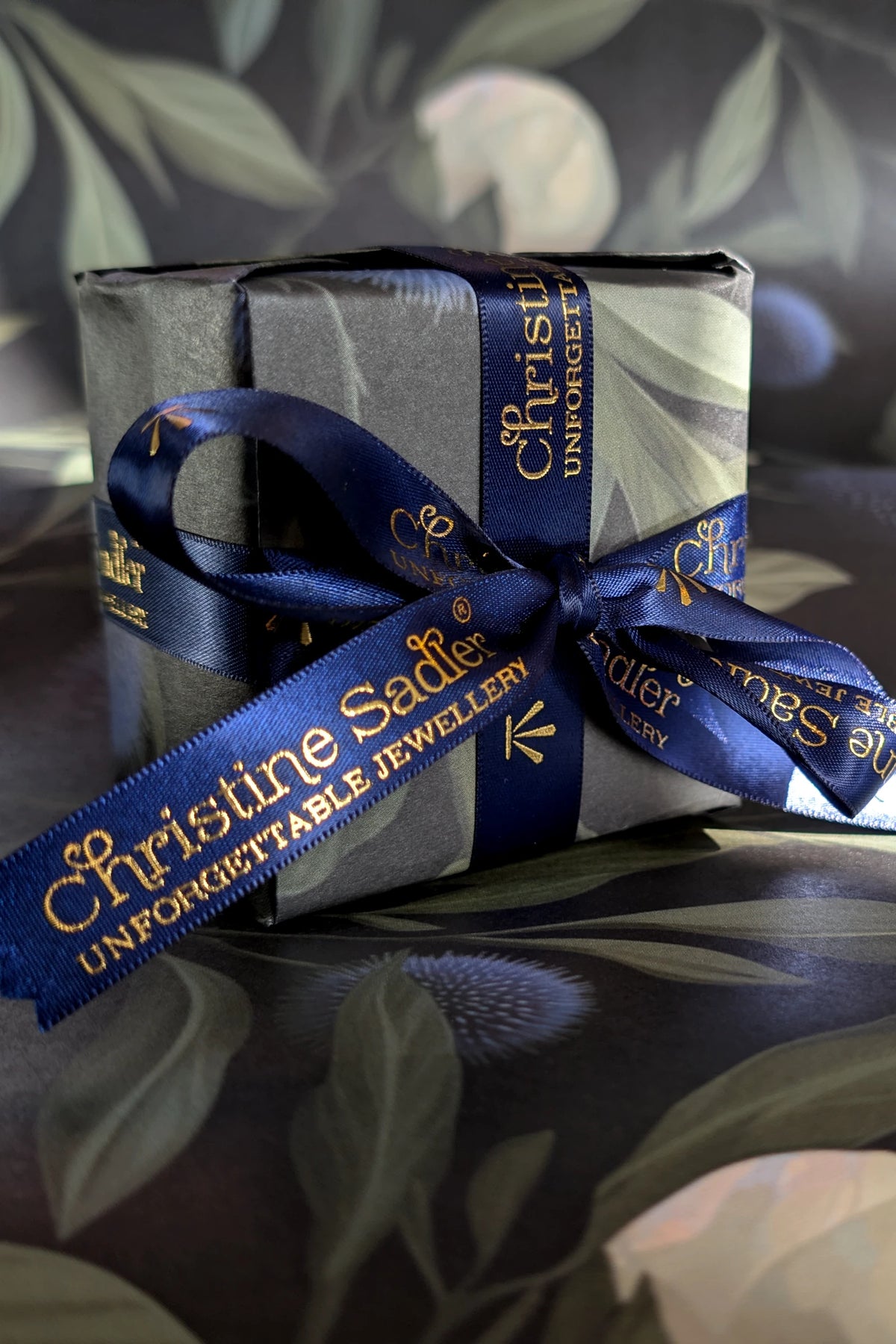 New Christine Sadler luxury gift wrapping with blue satin ribbon and gold lettering