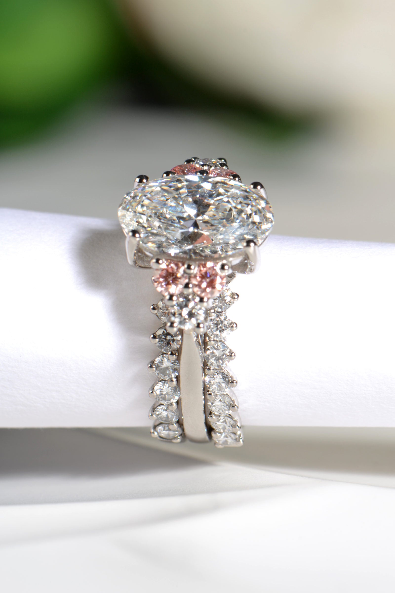 Two diamond guard rings, one on either side of the Rosé Spark lab diamond engagement ring - Christine Sadler