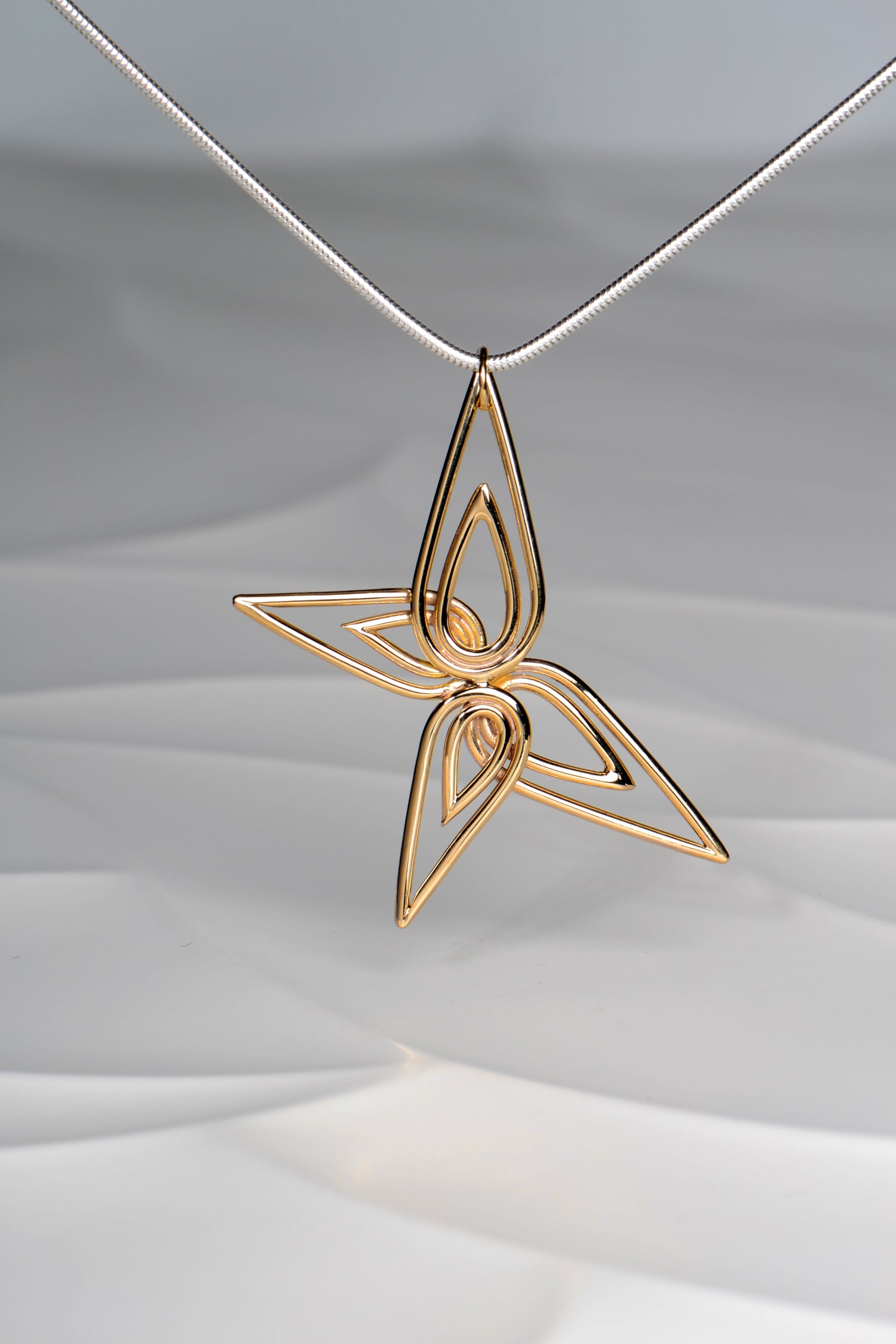 contemporary gold butterfly pendant on silver chain