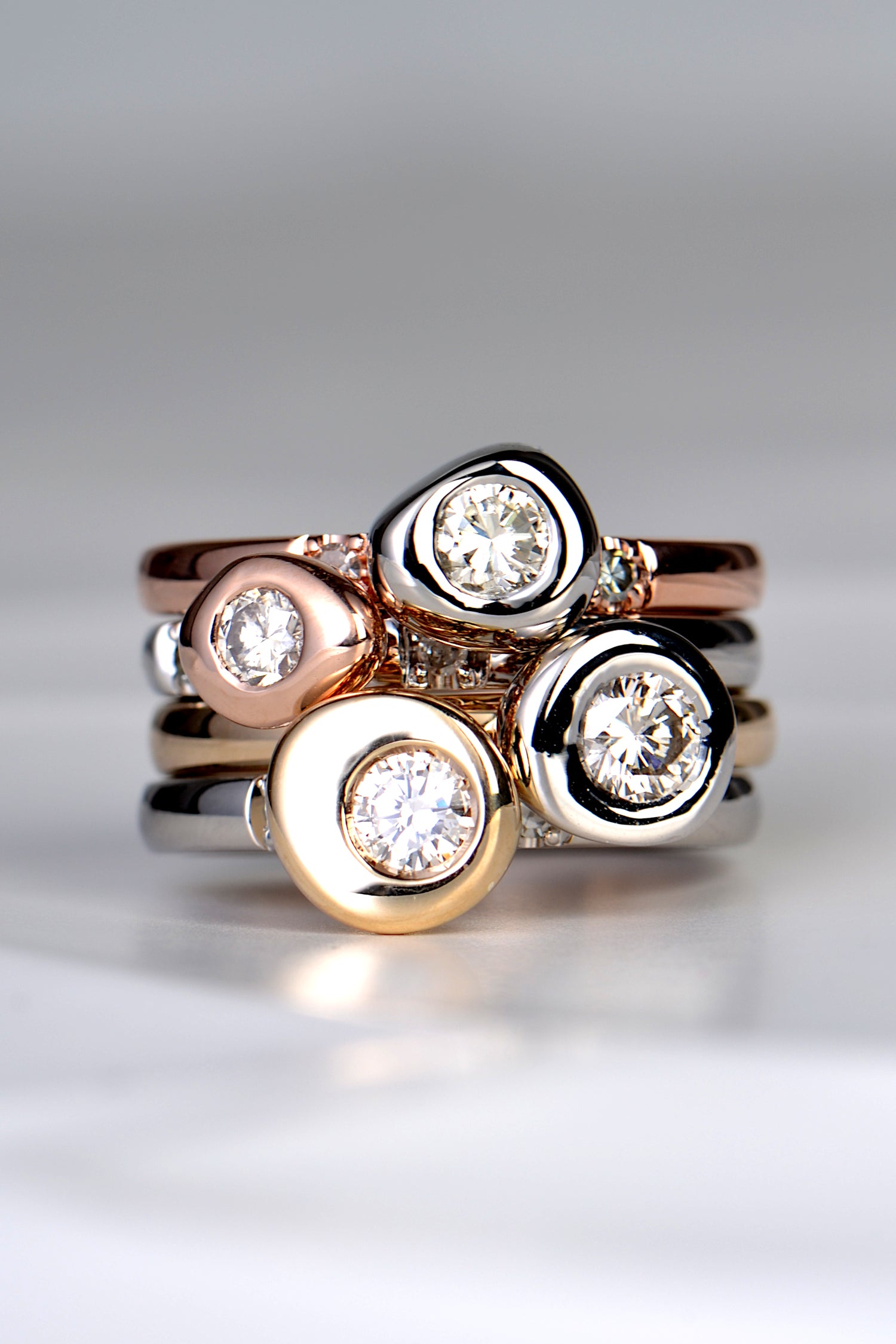 A really special and different set of unique diamond stacking rings with a Scottish contemporary design inspired by Cairns from Christine Sadler who designs and makes one of a kind jewellery