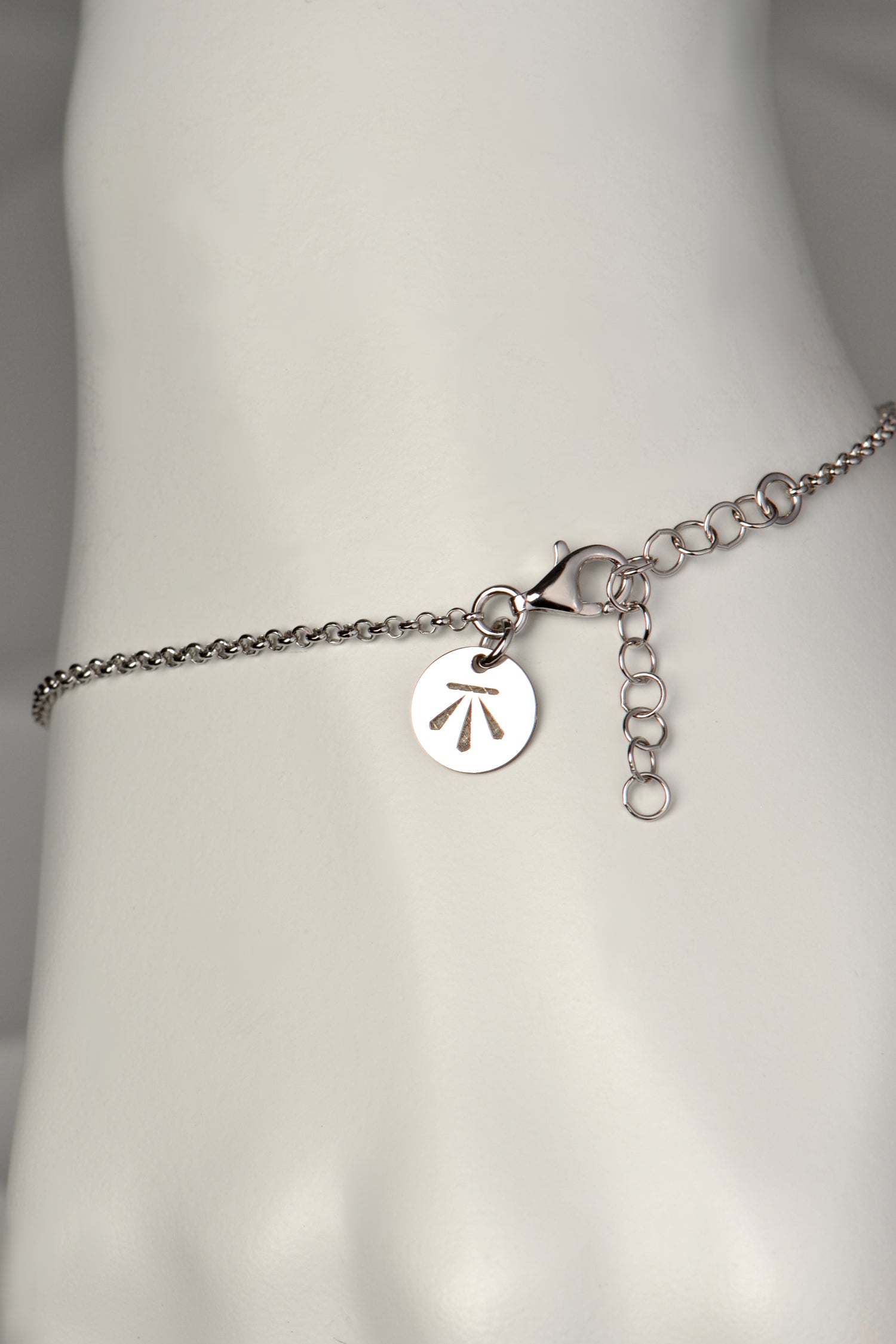 delicate silver talisman bracelet that is adjustable in length from contemporary jewellery designer Christine Sadler