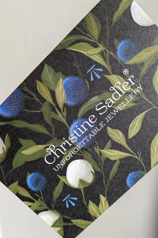 Christine Sadler luxury jewellery gift voucher with unique thistle and white rose design.