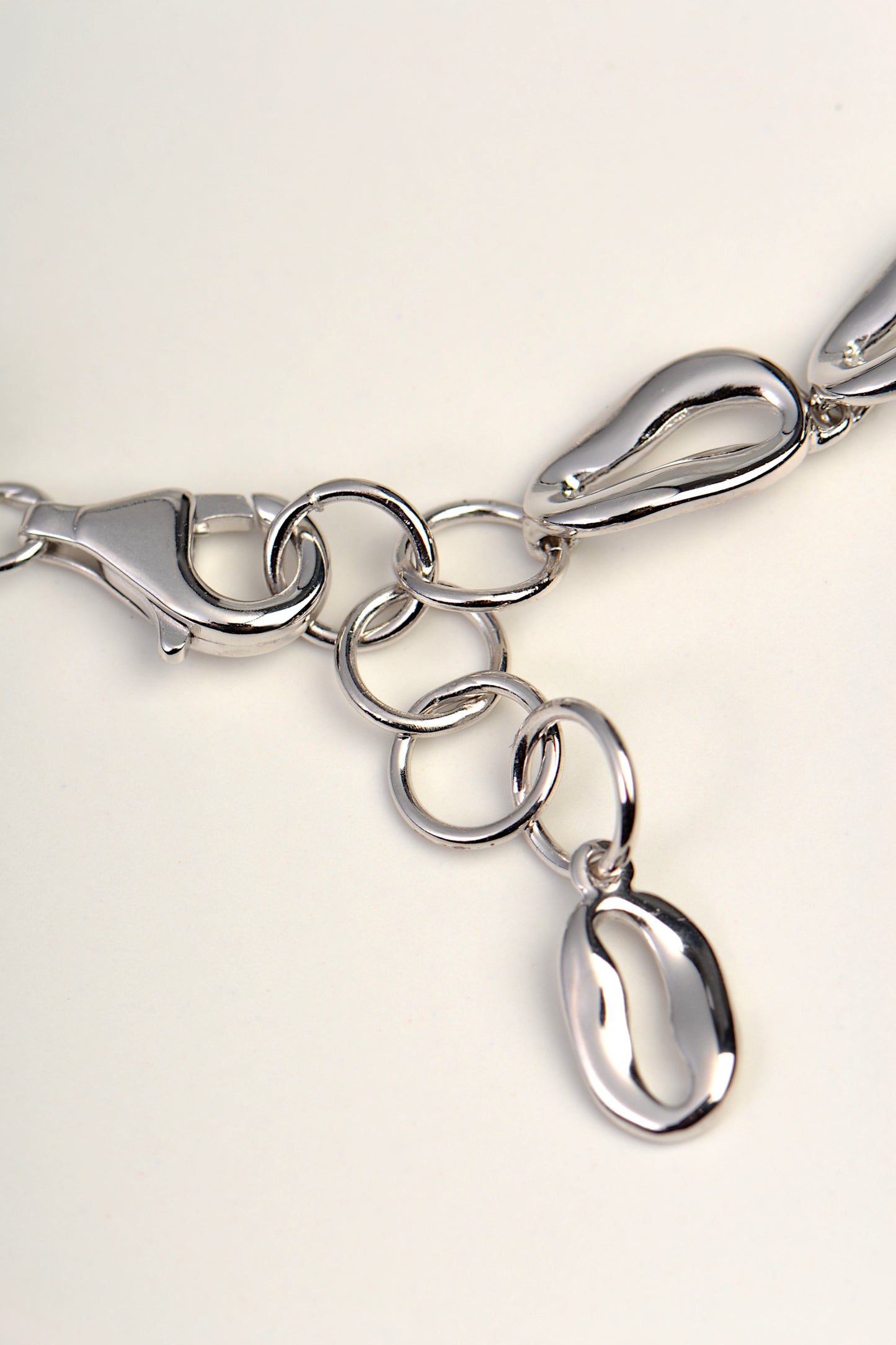 detail of the clasp on a designer silver coffee bean bracelet