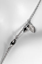 Modern seed shaped silver charm necklace. Called The Promise, for each one sold a tree is planted in Scotland