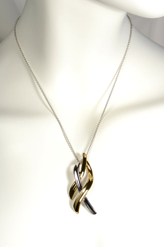 silver and gold vermeil large designer necklace with a ribbon like pendant design