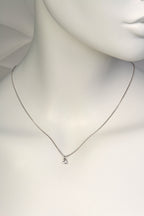 Delicate white gold heart necklace with diamond on mannequin to show scale- Christine Sadler