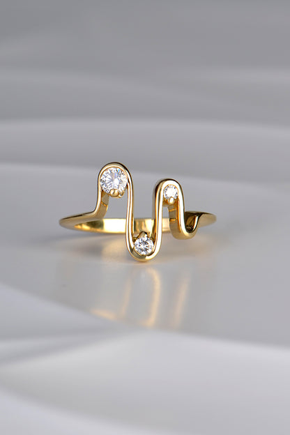 an 18ct yellow gold wavy ring with four waves and three diamonds inspired by a heartbeat