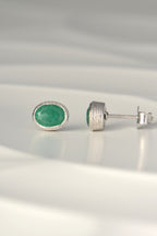 handmade silver and oval emerald stud earrings, the birthstone for May