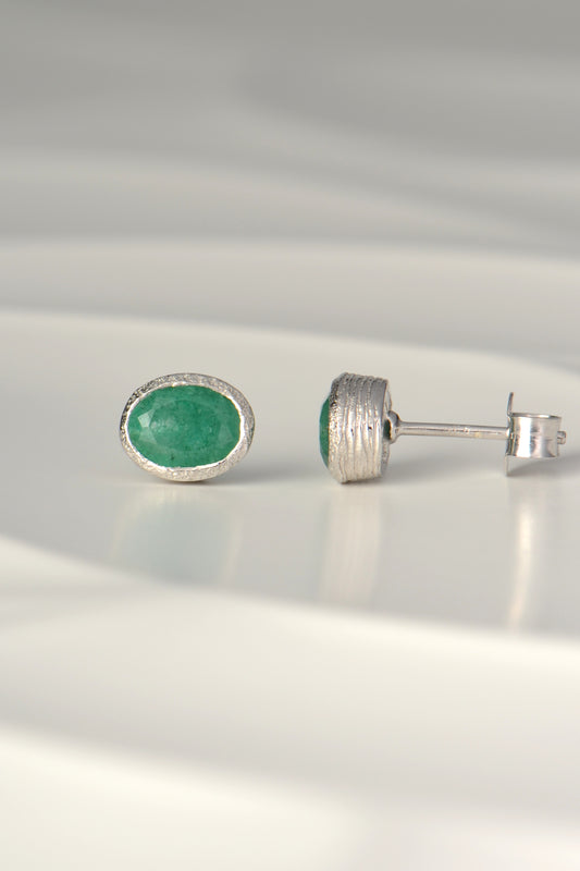 handmade silver and oval emerald stud earrings, the birthstone for May