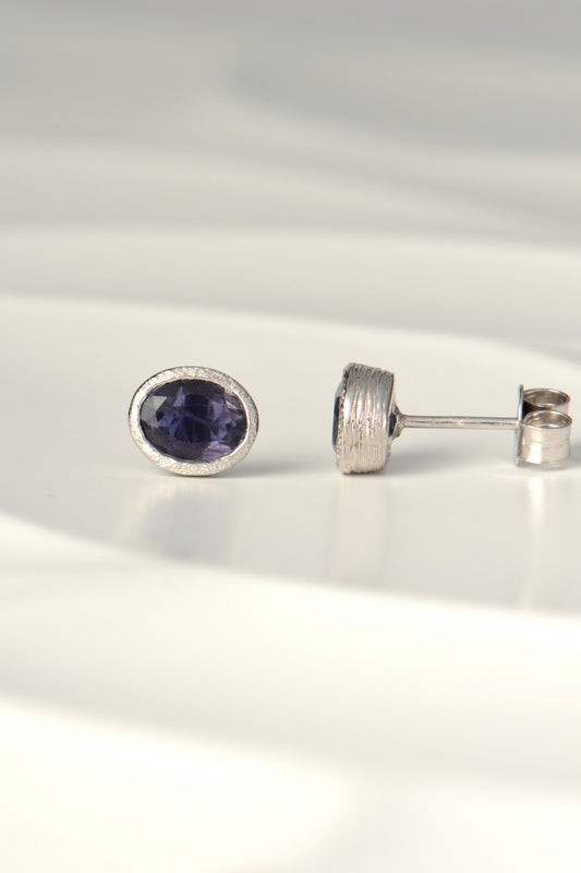 Oval blue sapphire stud earrings in silver, the birthstone for September
