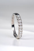 Platinum fishtail diamond wedding band set with nine round brilliant diamonds