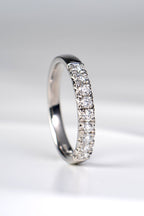 Platinum fishtail diamond wedding band set with nine round brilliant diamonds