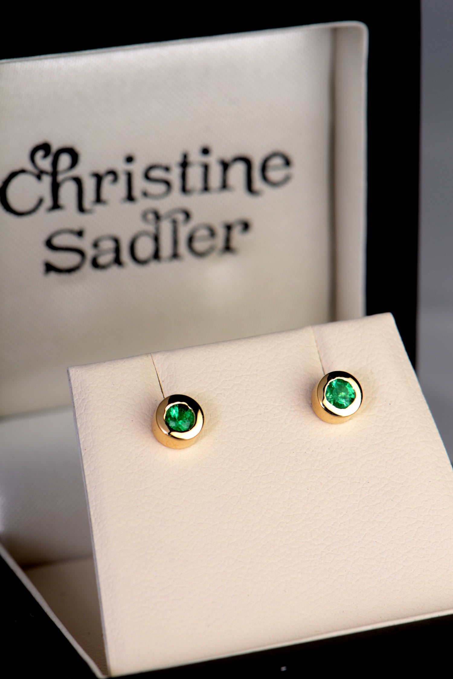 handmade yellow gold emerald stud stud earrings in a presentation box from UK  jewellery designer Christine Sadler who is based in Ayr Scotland
