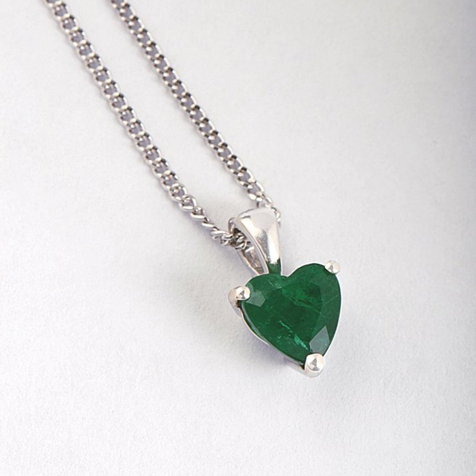 Emerald and white gold necklace made for the birth of a baby girl in May from jewellery designer Christine Sadler