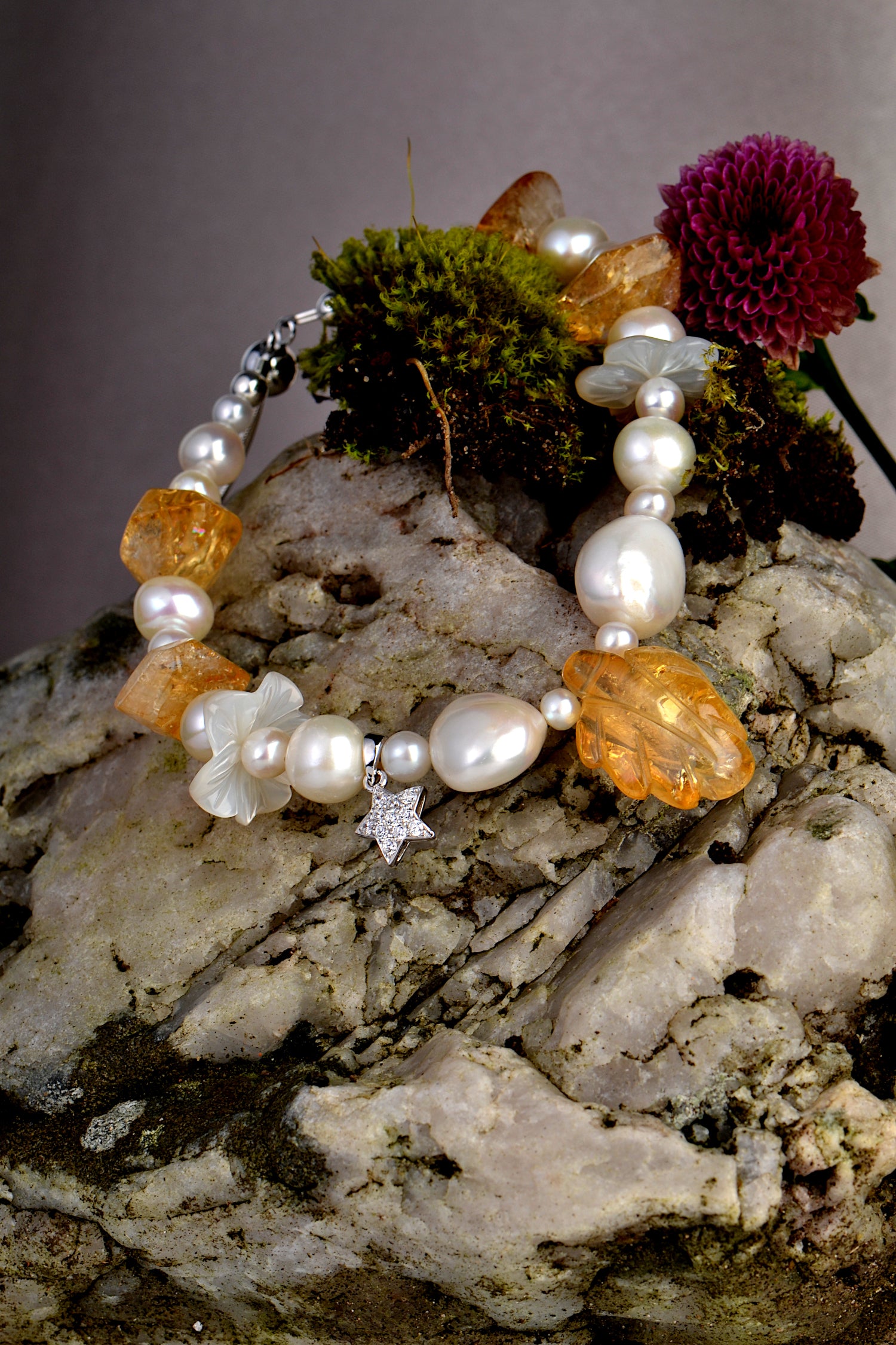 designer pearlfairy  bracelet on rock with moss and flower