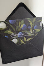 branded Christine Sadler gift voucher in black envelope