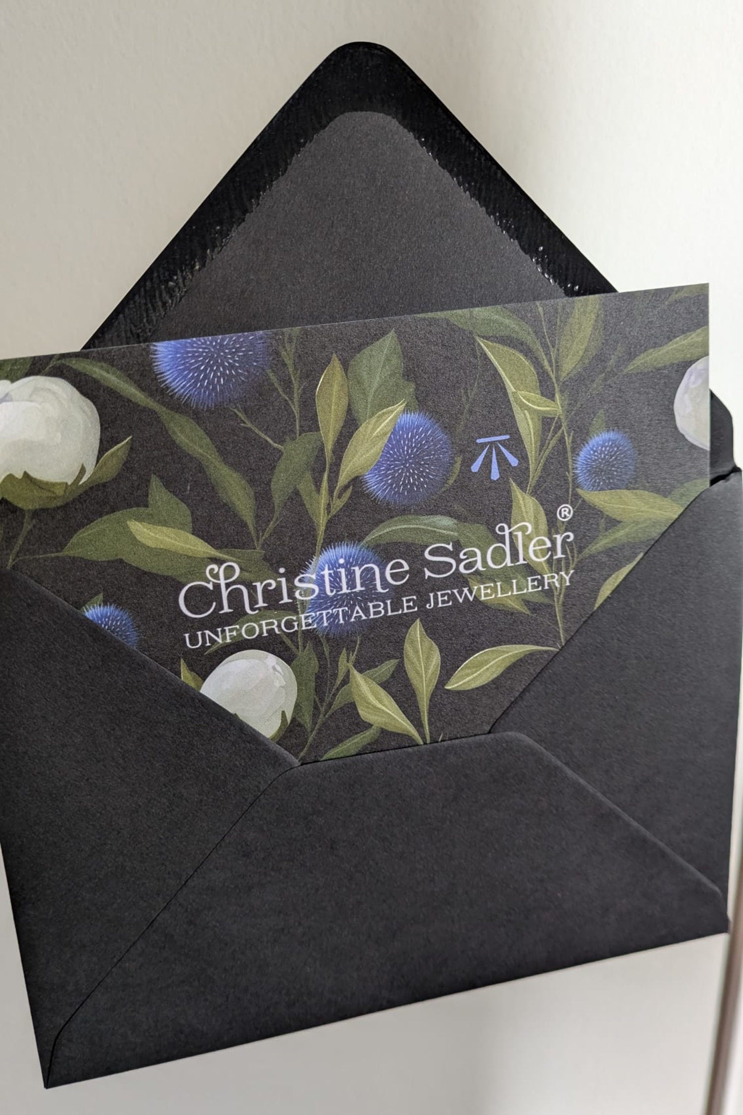 branded Christine Sadler gift voucher in black envelope