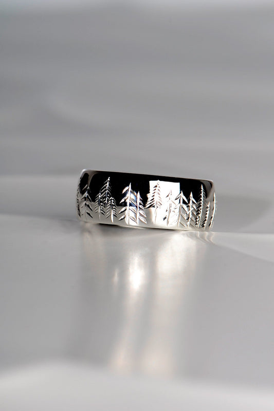 Platinum ring with trees hand engraved on it for a man or woman
