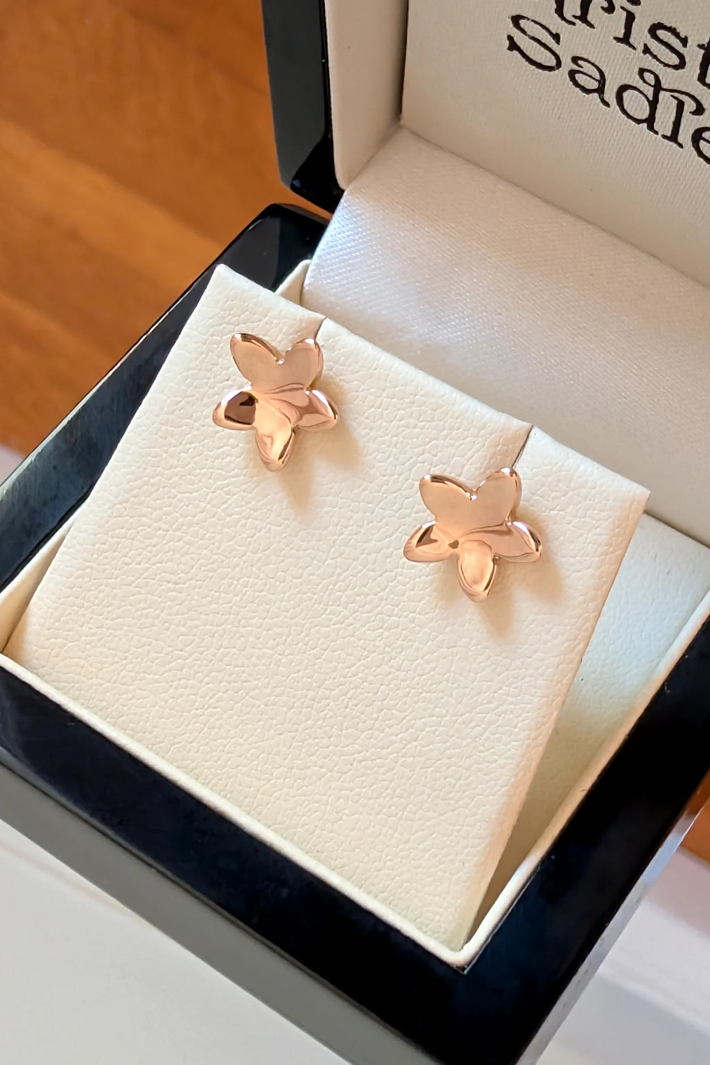 9ct rose gold small five petal flower stud earring in a presentation gift box. 