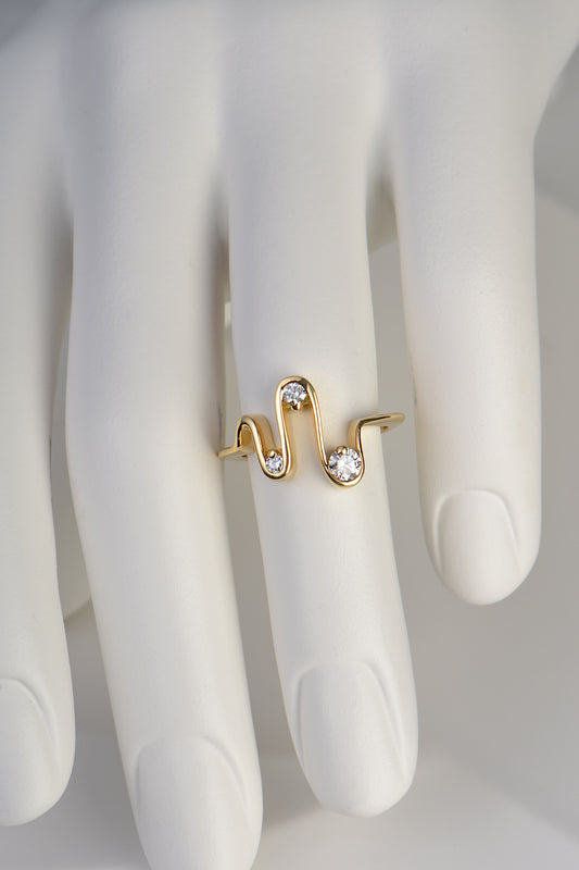 18ct yellow gold diamond three stone designer ring with a wave shape inspired by a heartbeat