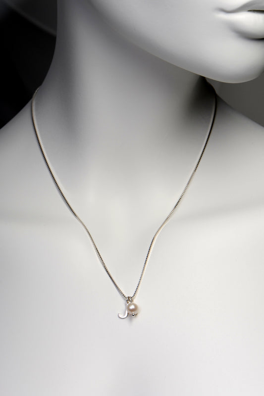 small real silver initial pendant with a real pearl on a sterling silver chain from Christine Sadler
