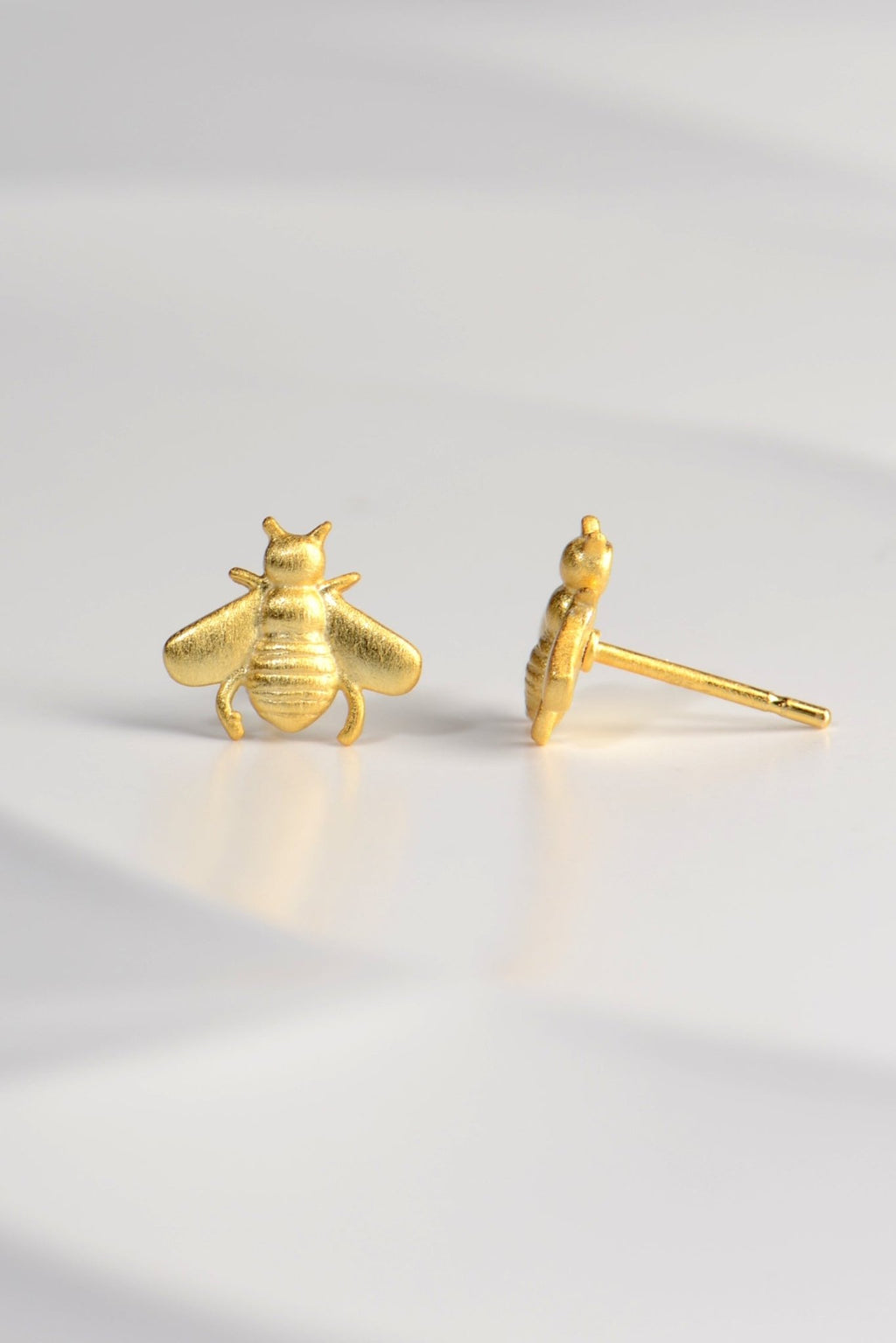 designer bee earrings by Jorge Revilla