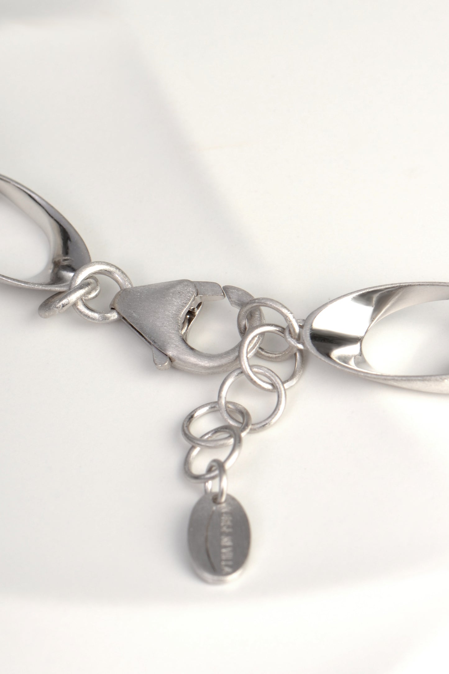strong clasp and adjustable length on sterling silver chain link necklace that is modern and sculptural from Jorge Revilla