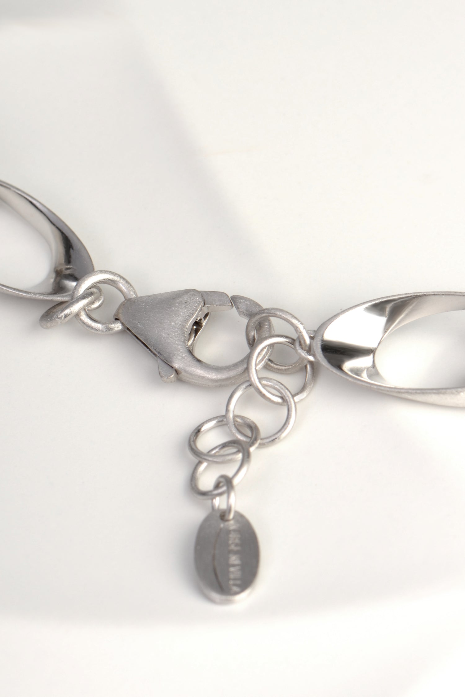 strong clasp and adjustable length on sterling silver chain link necklace that is modern and sculptural from Jorge Revilla