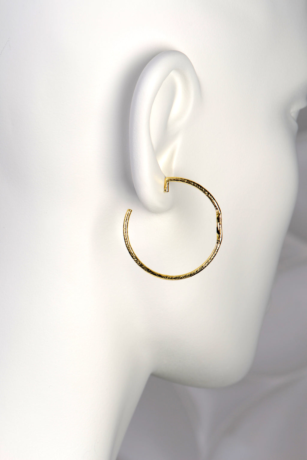 large gold vermeil designer hoop earrings by Jorge Revilla