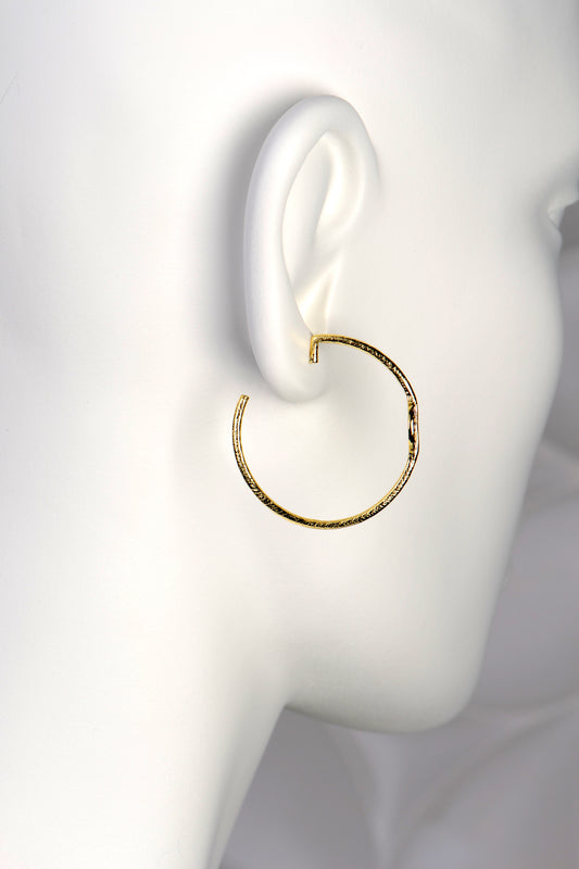 large gold vermeil designer hoop earrings by Jorge Revilla