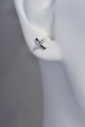 silver cross over kiss stud earrings set with 6 cubic zirconias in one line