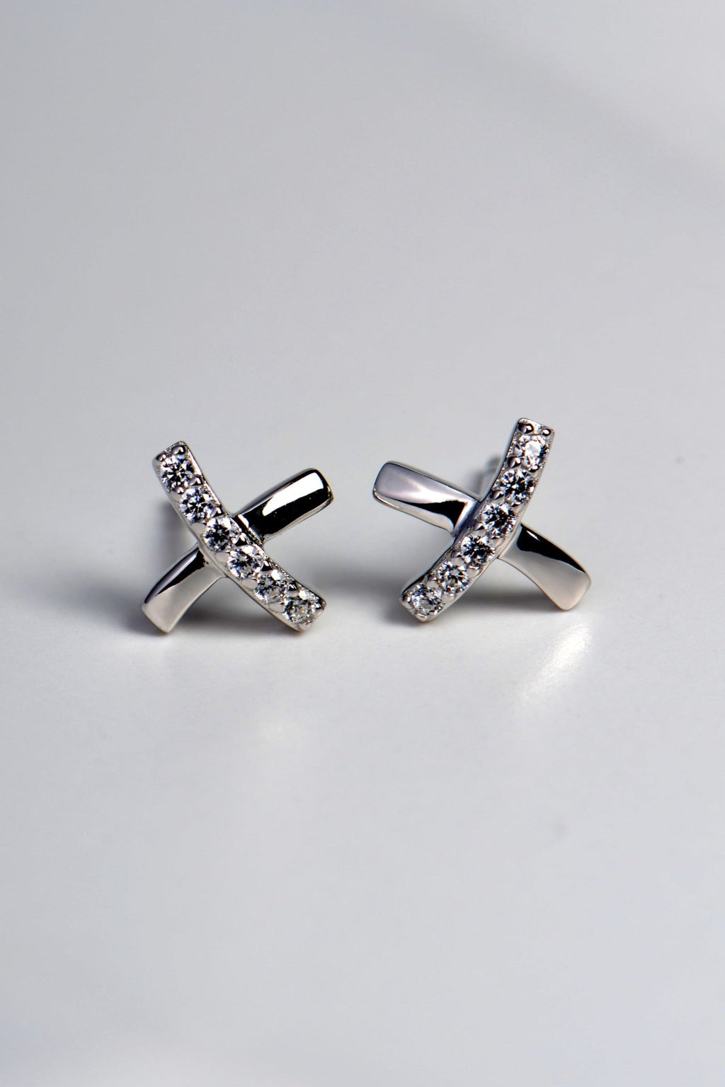 X shaped sterling silver earrings set with 6 stones in each