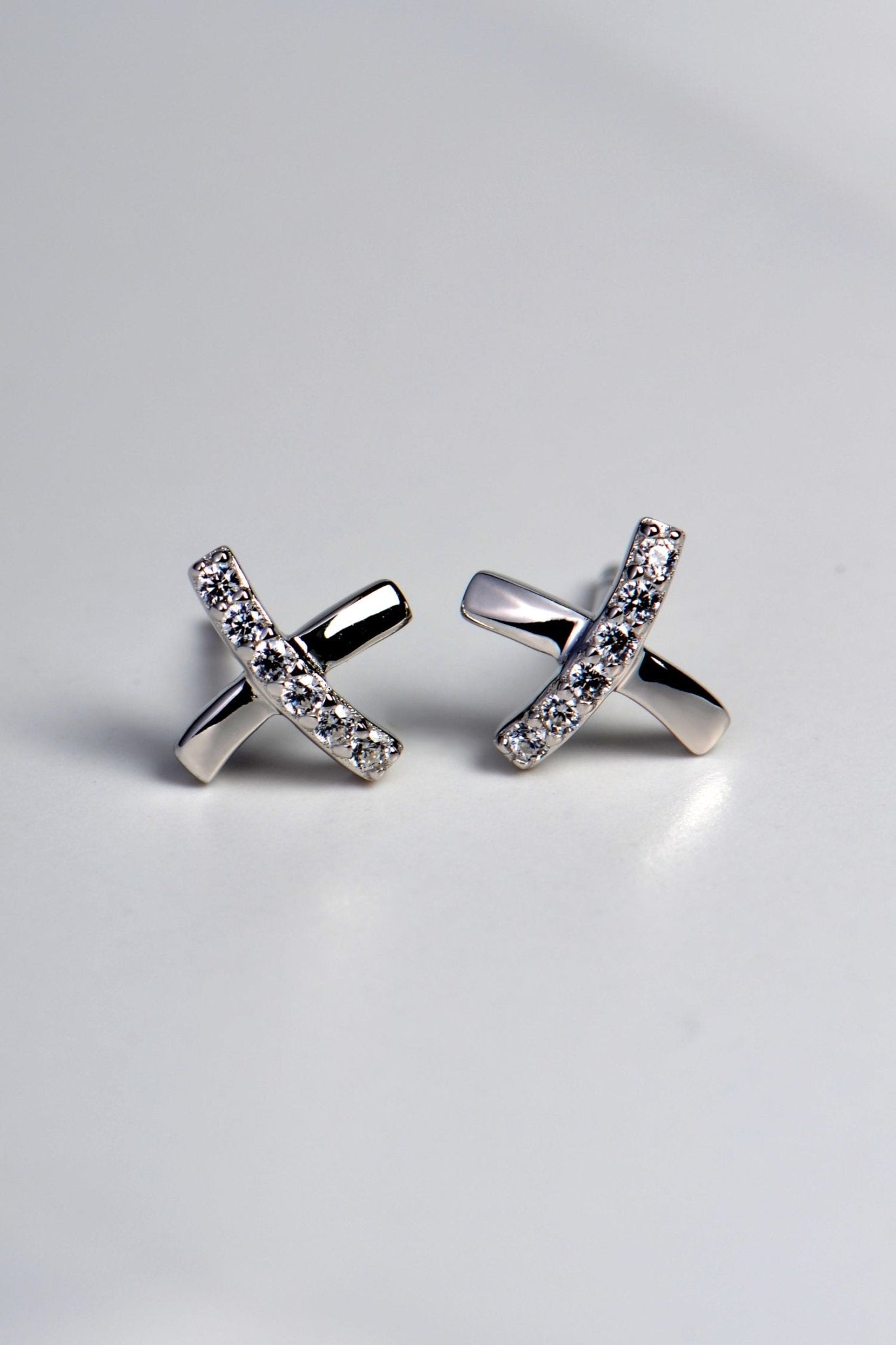 X shaped sterling silver earrings set with 6 stones in each