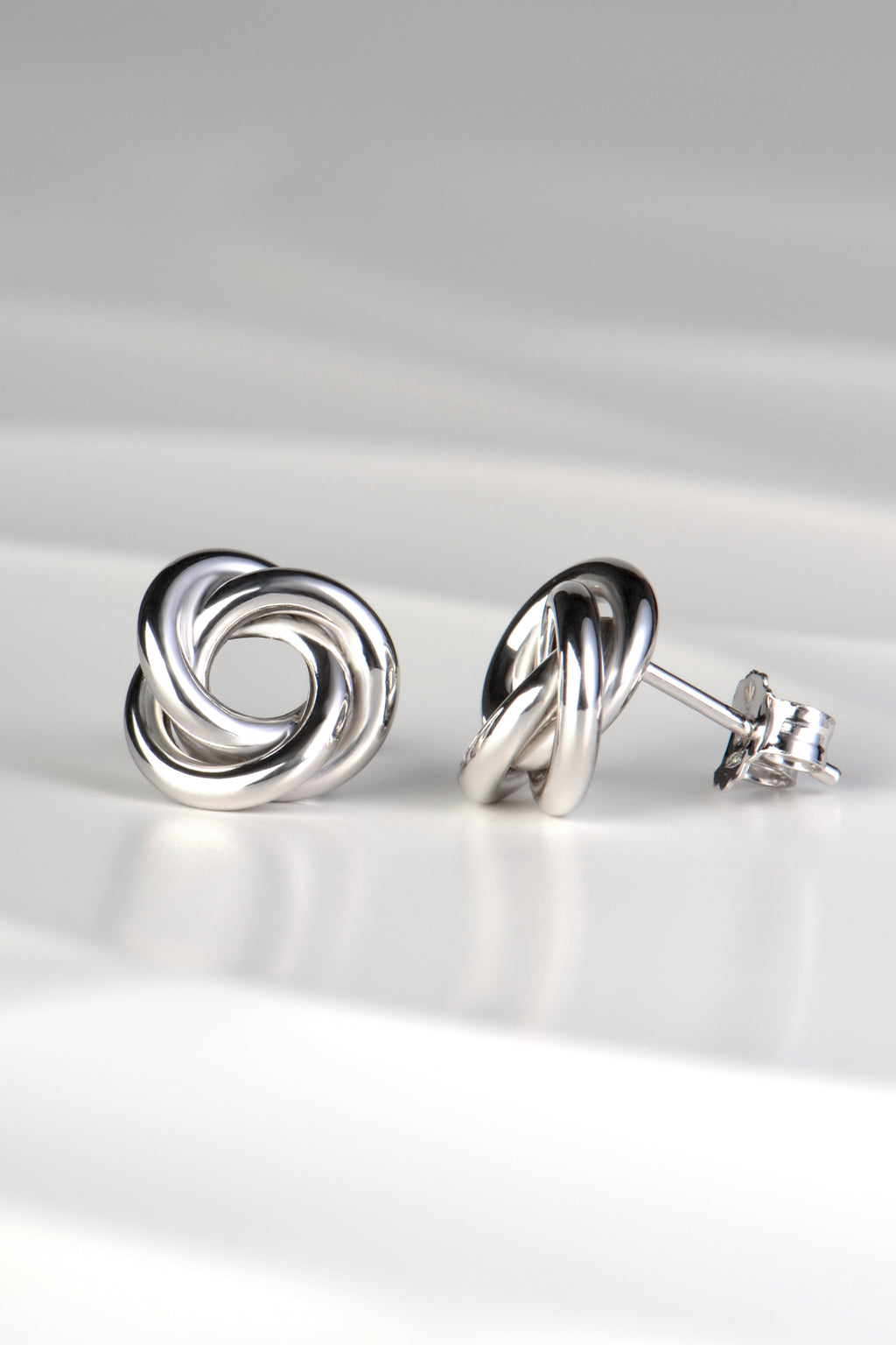 modern silver knot stud earrings with posts and scroll backs from Christine Sadler