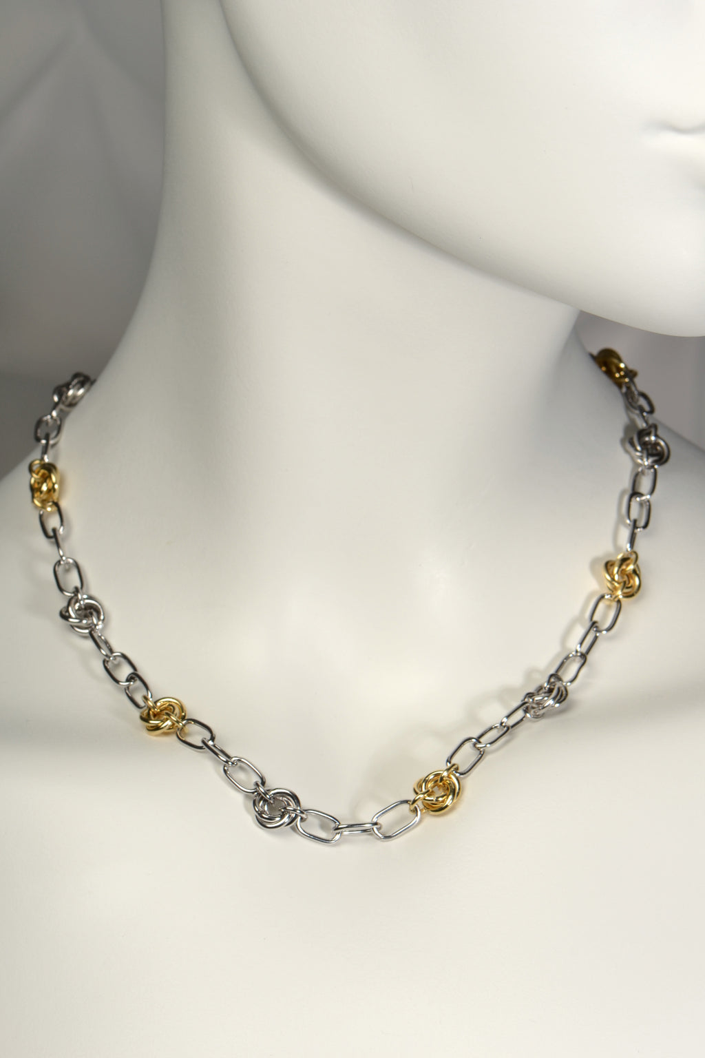 modern high quality silver friendship knot necklace with alternating silver and gold vermeil knots. A contemporary chain necklace from Christine Sadler