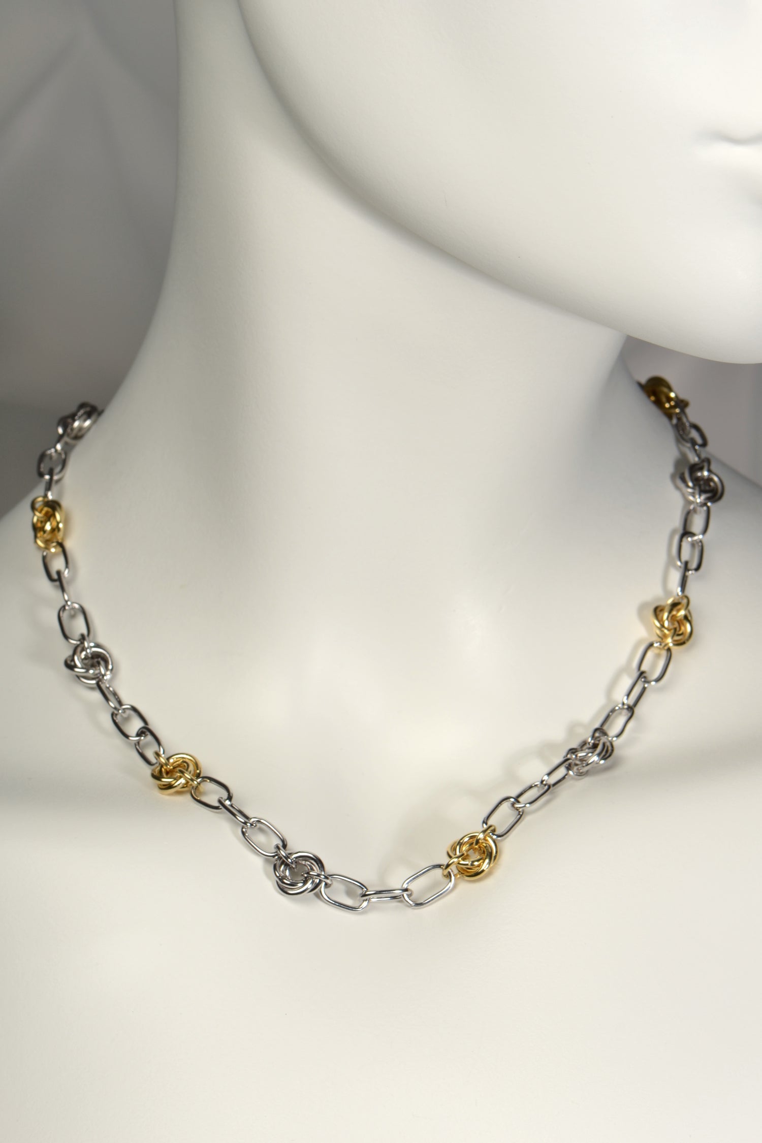 modern high quality silver friendship knot necklace with alternating silver and gold vermeil knots. A contemporary chain necklace from Christine Sadler