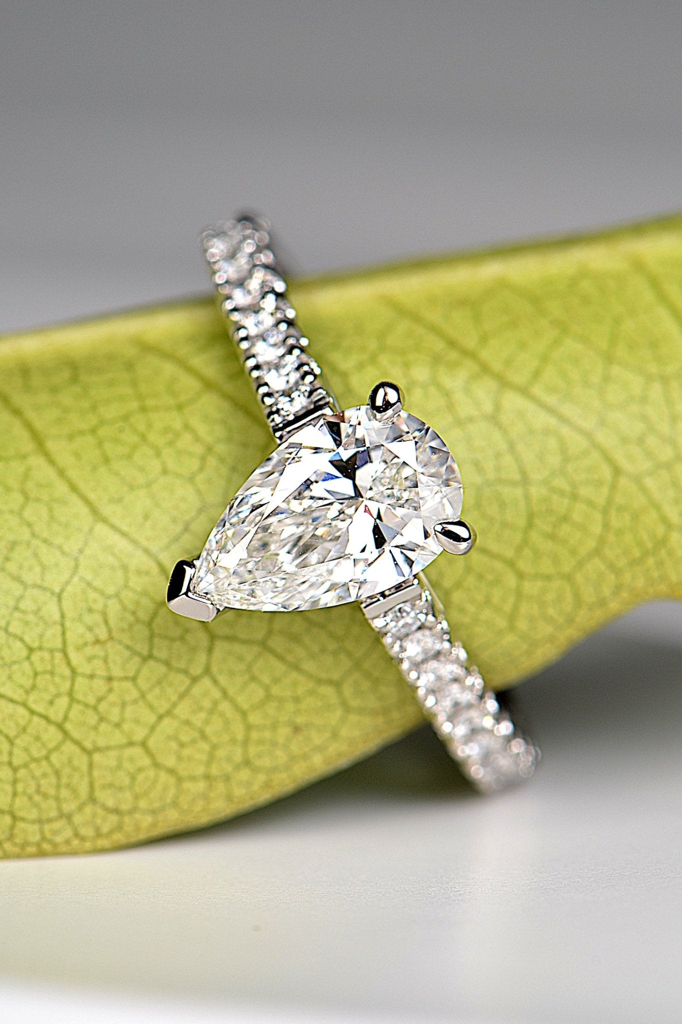 modern affordable engagement ring platinum with a pear cut diamond. Available in mined or lab grown diamonds