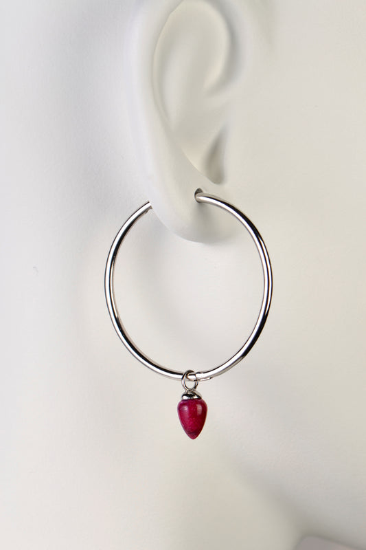 Large sterling silver designer hoop earring with a ruby by jewellery designer Jorge Revilla