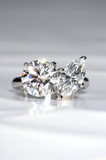 Handcrafted Toi et Moi lab diamond engagement ring, marquise cut and round, in hallmarked platinum 950 on a crisp white background by Christine Sadler