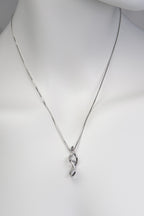 Front view of dna double helix necklace on white mannequin bust against plain background - Christine Sadler