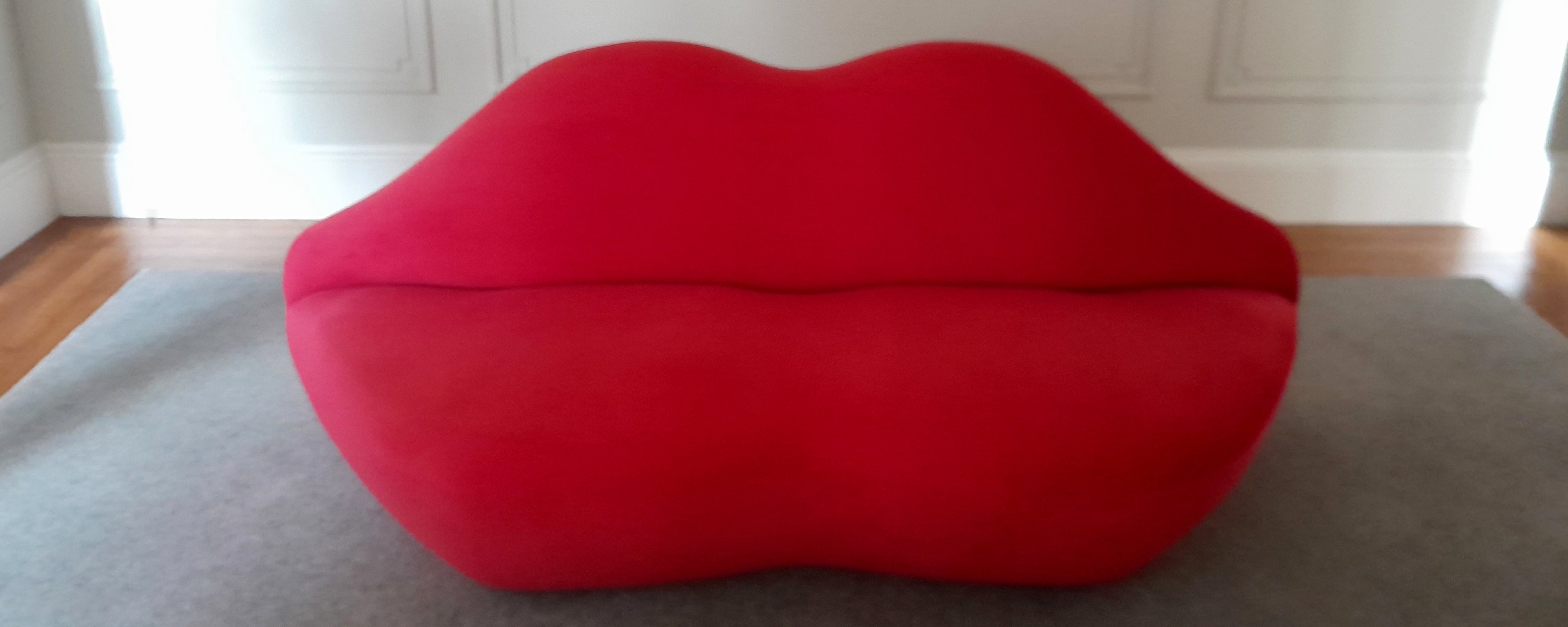 Red lips sofa in jewellery designer Christine Sadler's studio in Ayr Scotland that you can visit to buy jewellery in person or to commission or remodel jewellery