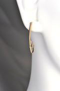 designer long drop yellow gold earrings