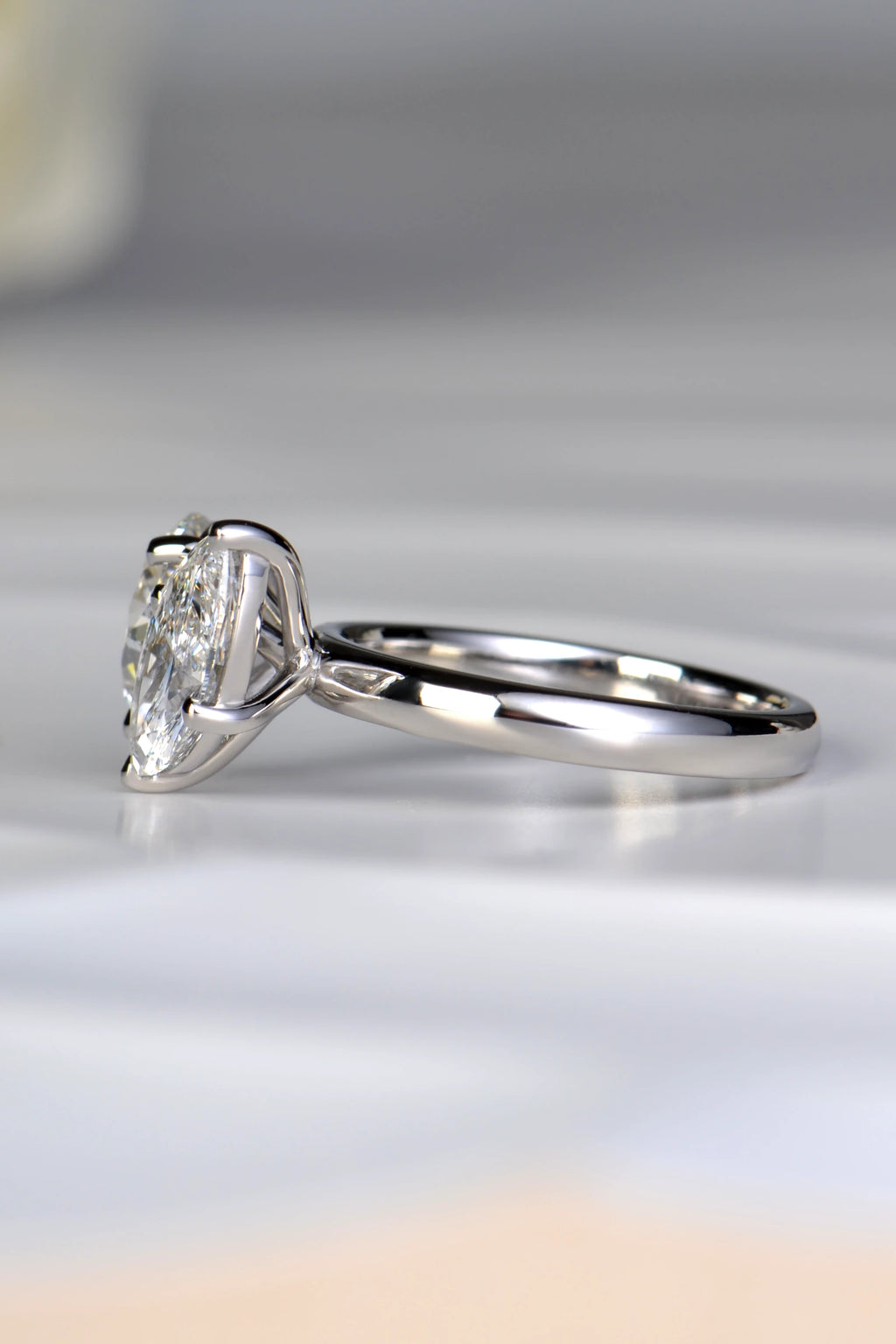 Side angle view of a 1.54ct marquise cut lab diamond set at a dynamic 45 degree angle on a premium platinum band by Christine Sadler