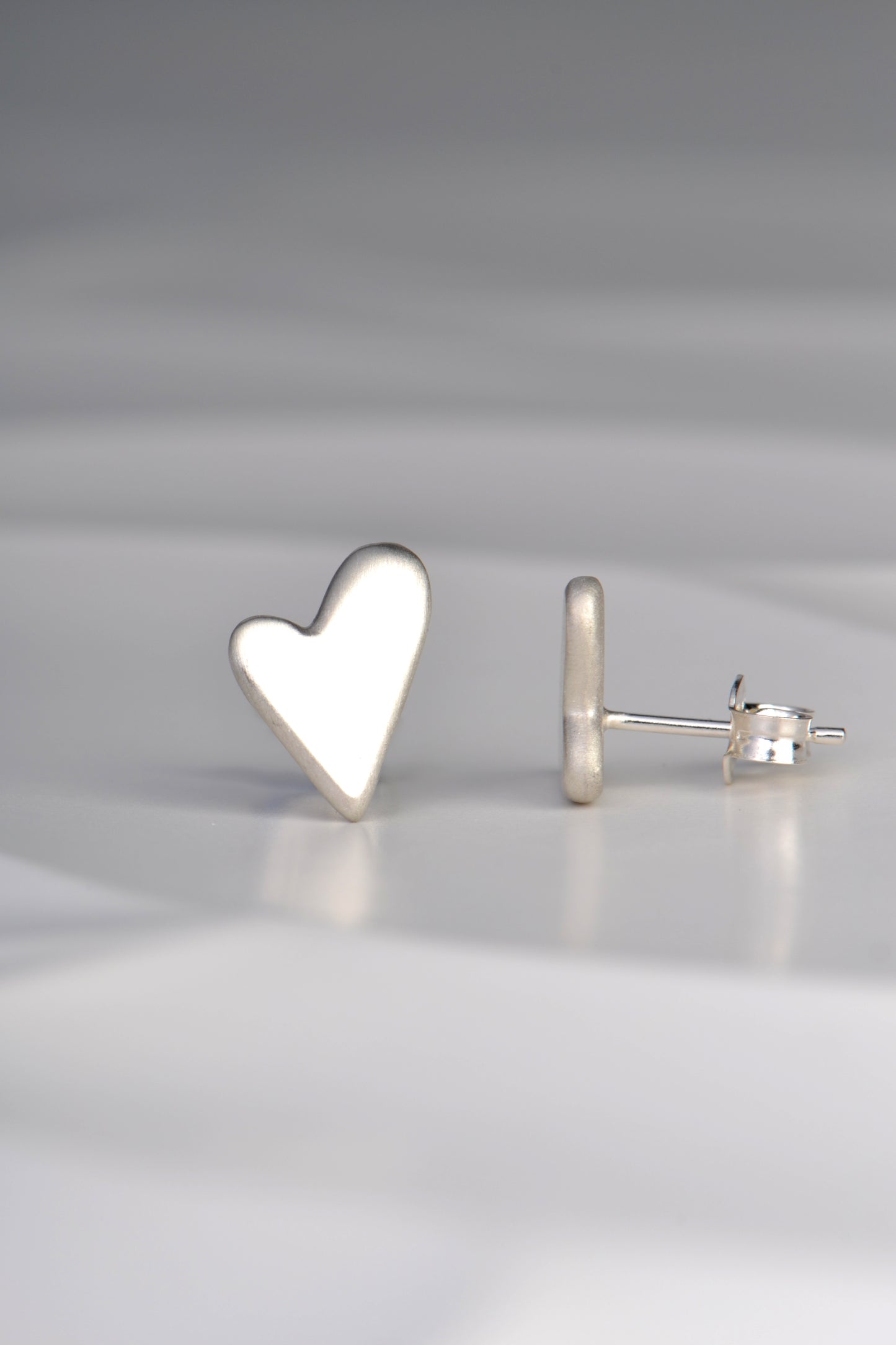 These designer heart shaped earrings sit flat to the earlobe and are very comfortable to wear