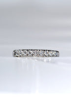 Close-up of the fishtail setting showing round brilliant diamonds in platinum